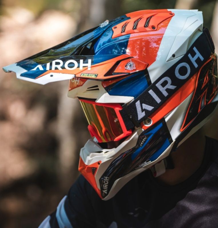 Rider wearing Airoh Aviator 3 off-road helmet with goggles and peak visor