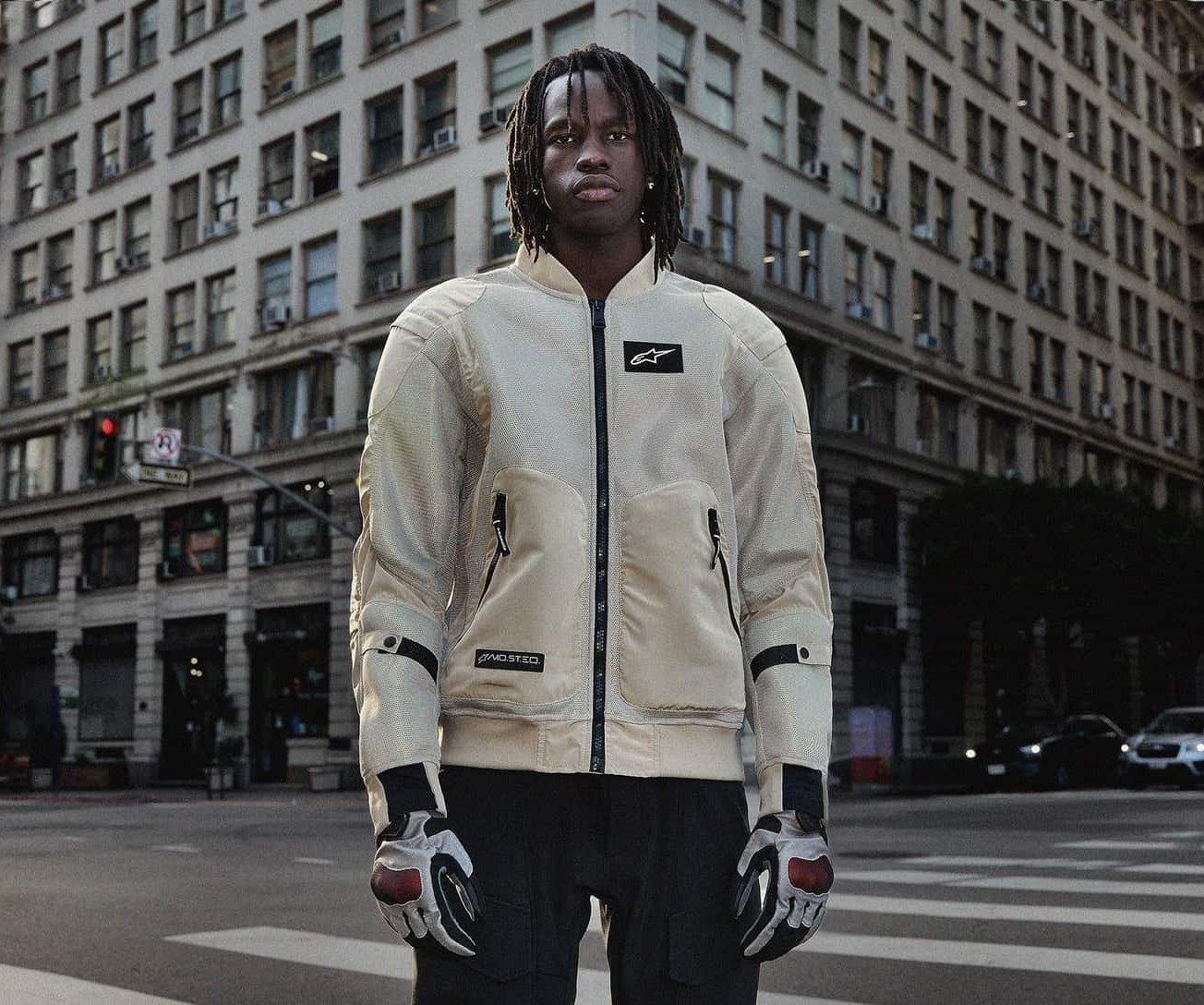 Rider wearing Alpinestars Flight Air mesh motorcycle jacket in an urban city setting