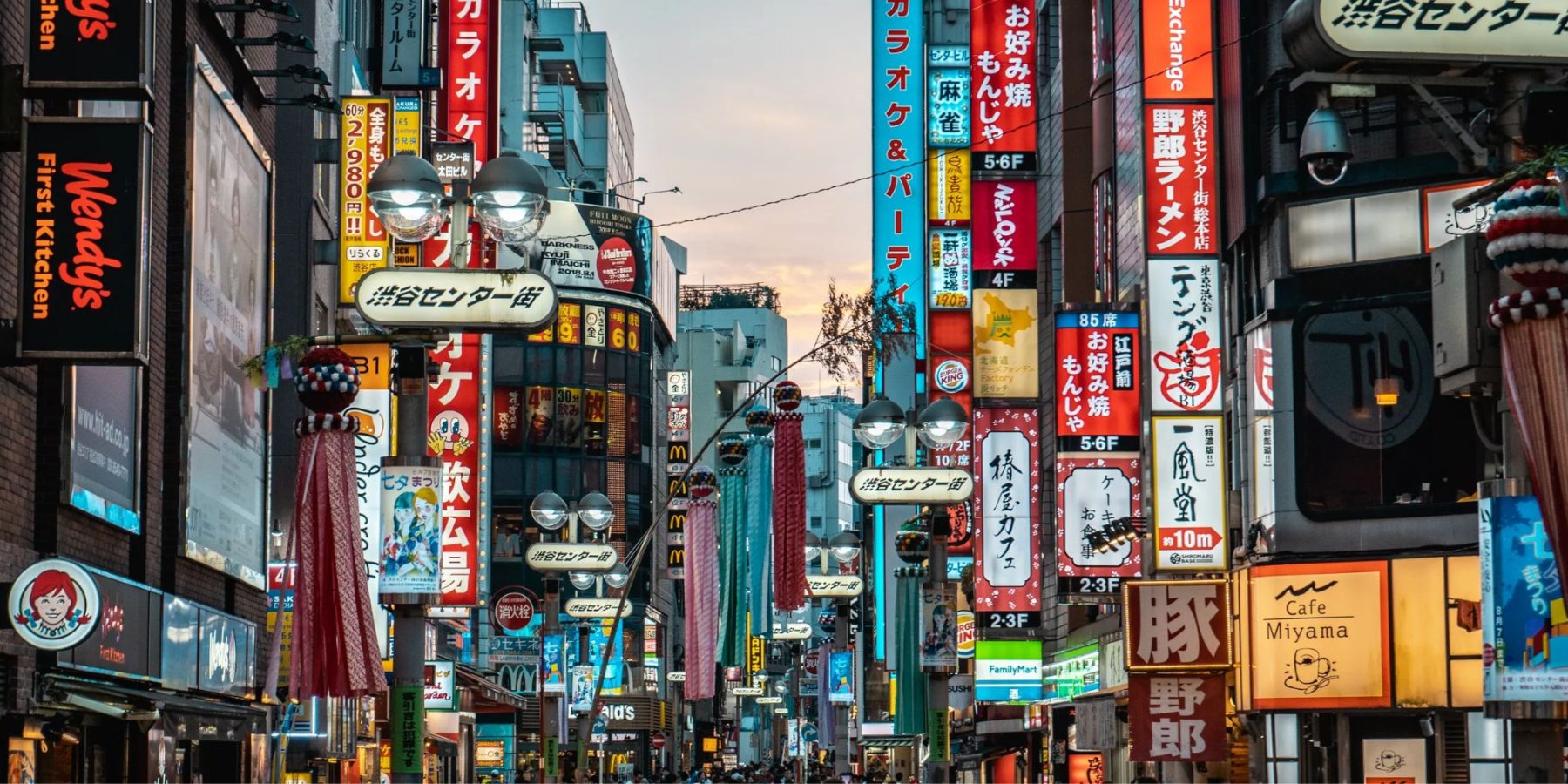 Scene of tokyo with neon signs.
