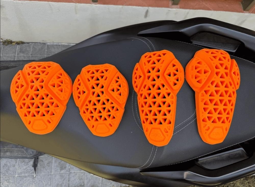 Set of D3O CE-certified motorcycle armor pads for shoulders and elbows on a bike seat