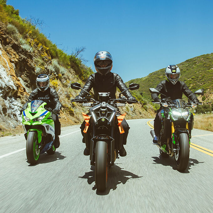 Three riders wearing Bell Lithium MIPS helmets riding sport bikes on a mountain road