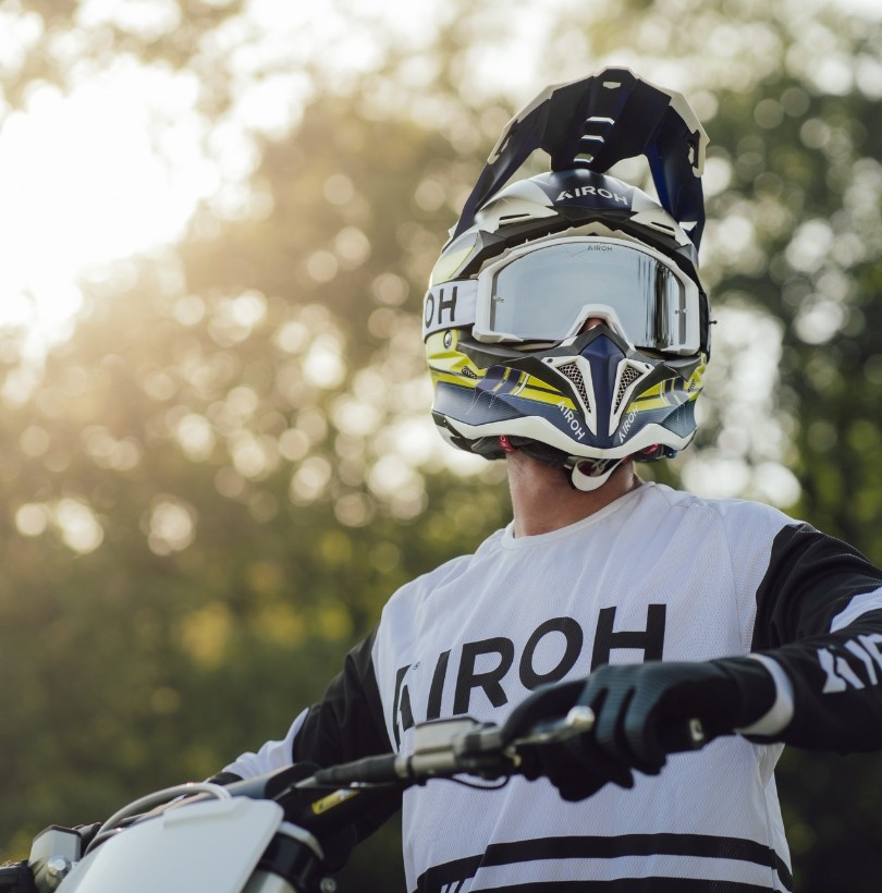 Rider wearing Airoh Aviator 3 carbon off-road helmet with goggles on a dirt bike