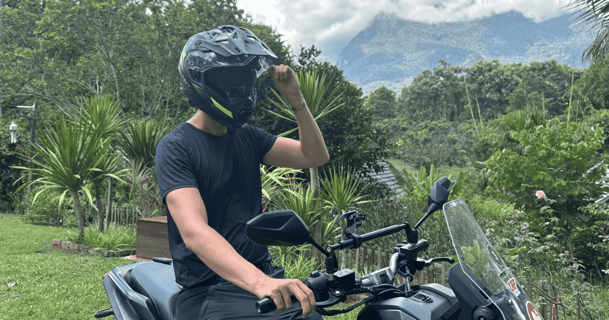 Rider wearing the NEXX X.WED 3 adventure helmet with visor up
