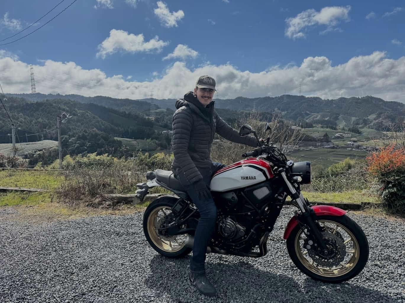 Rider wearing casual outerwear on a Yamaha motorcycle with protective base layers underneath