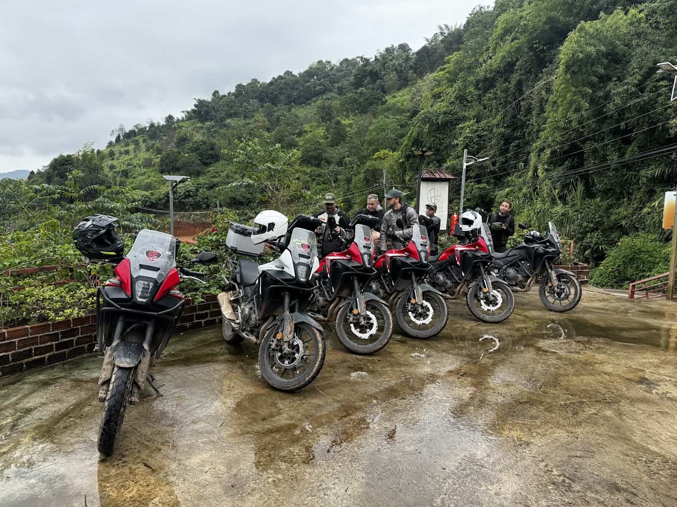 Motorcycles lined up after a rain-soaked ride during the Ride of Passage.