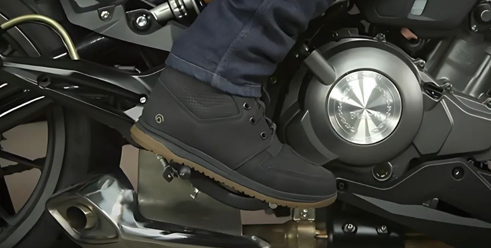 Close-up of REAX Fulton Air Riding Shoes on motorcycle footpeg
