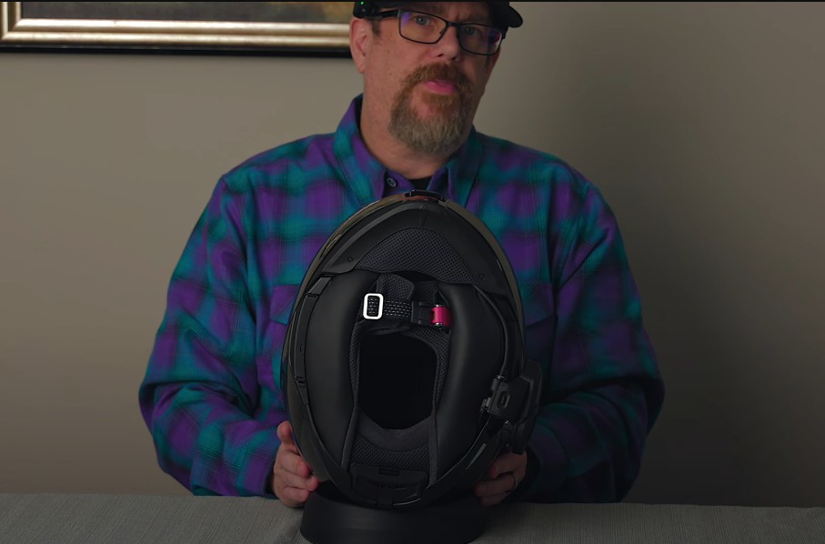 Bottom view of Shoei Neotec 3 showing thick neck roll, chin curtain, and ratcheting strap