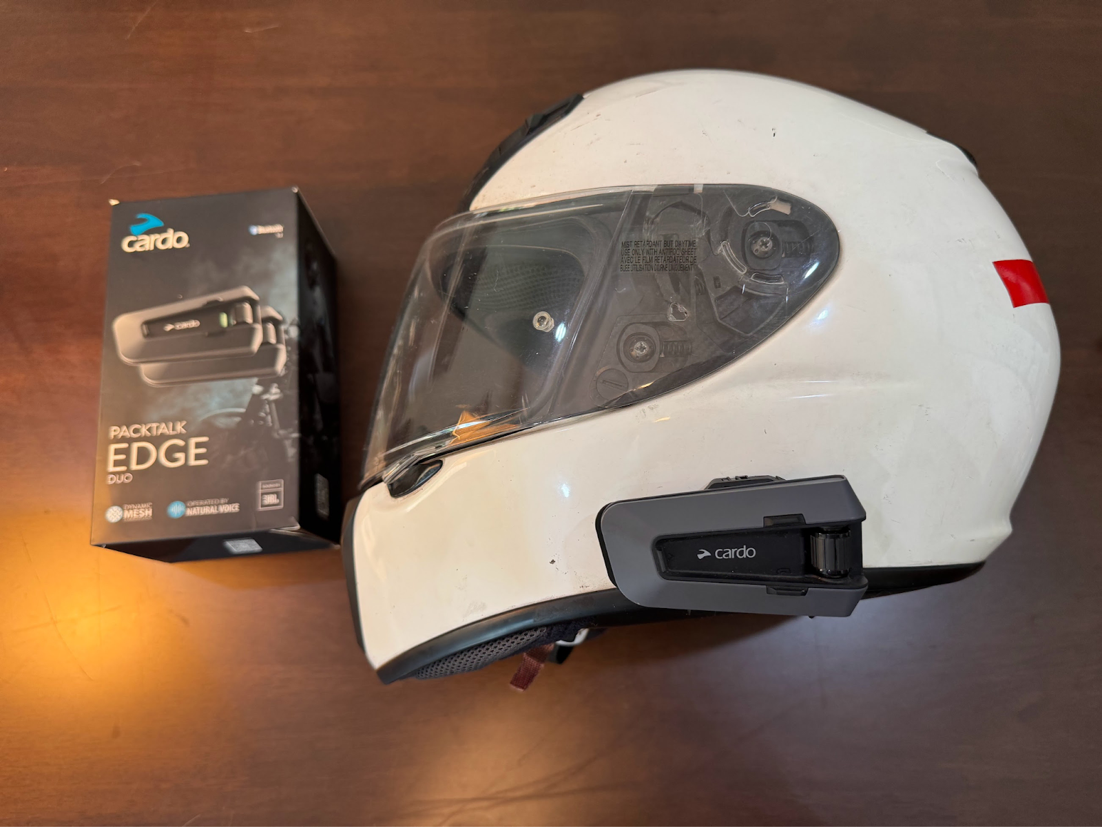 Cardo Packtalk Edge mounted on helmet