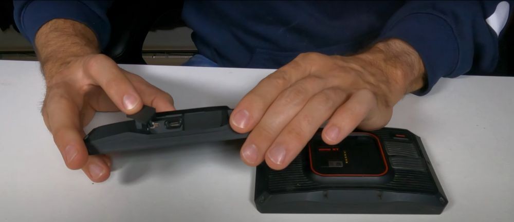 Close-up of Garmin XT2 with USB-C port and older XT unit showing mini USB connector