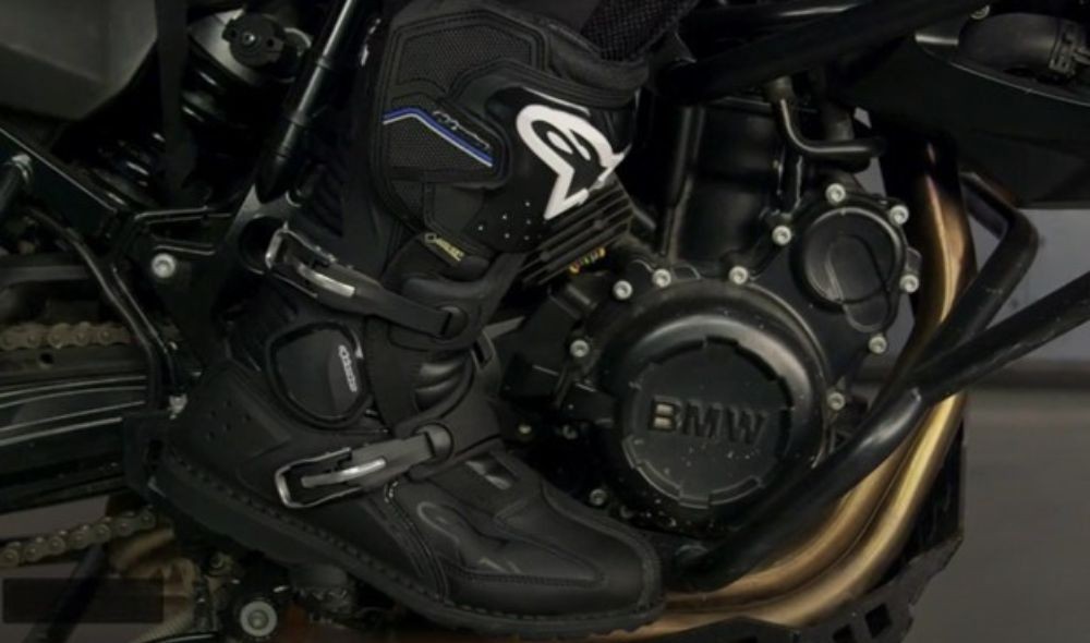 Close-up of Alpinestars Toucan Gore-Tex boots on BMW adventure motorcycle footpeg