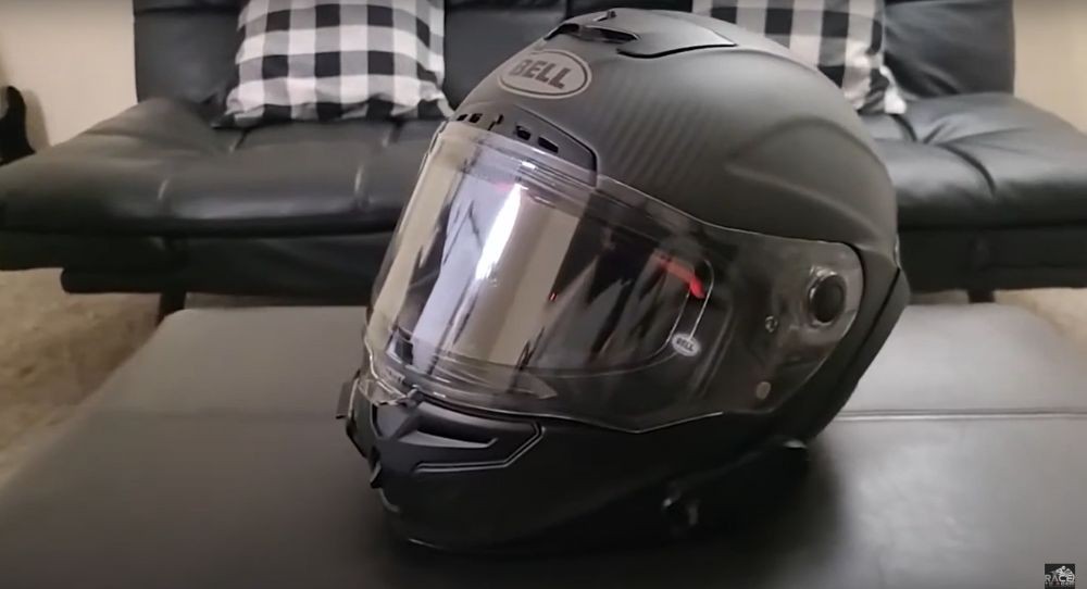 Bell Race Star Flex DLX helmet in matte black on leather surface