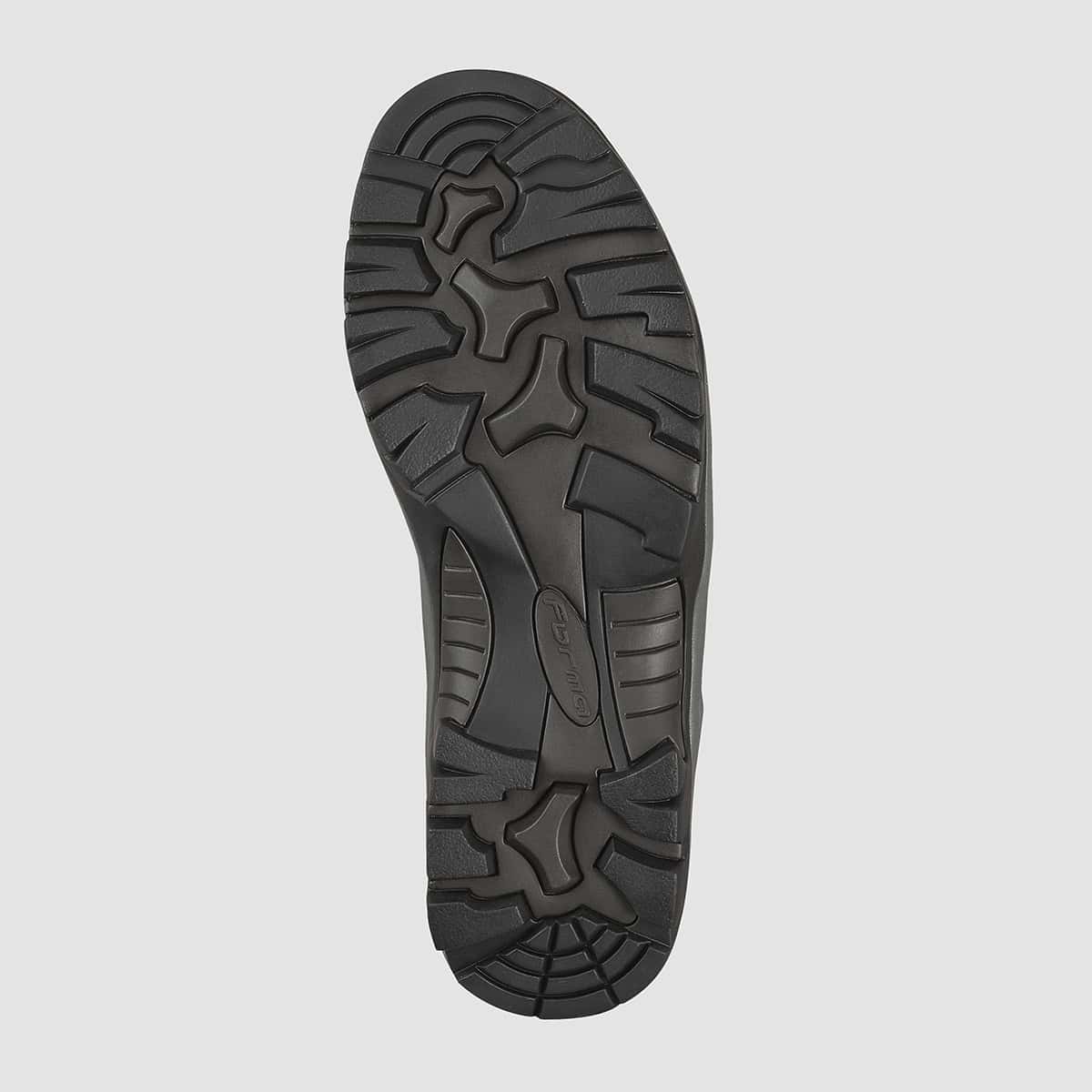 Close-up of a motorcycle boot sole with lug pattern designed for grip on various surfaces and comfort on foot.