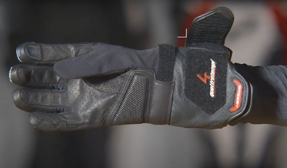 Close-up of an armored adventure motorcycle glove in profile