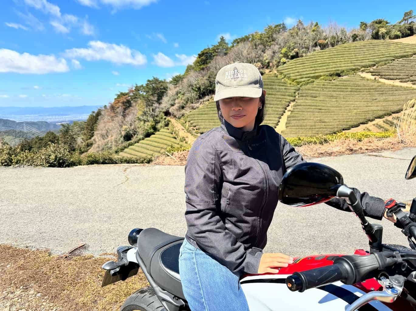 Woman wearing the REV’IT! Eclipse 2 Women’s Jacket on a motorcycle in a scenic mountain road, showcasing its breathable mesh fit.