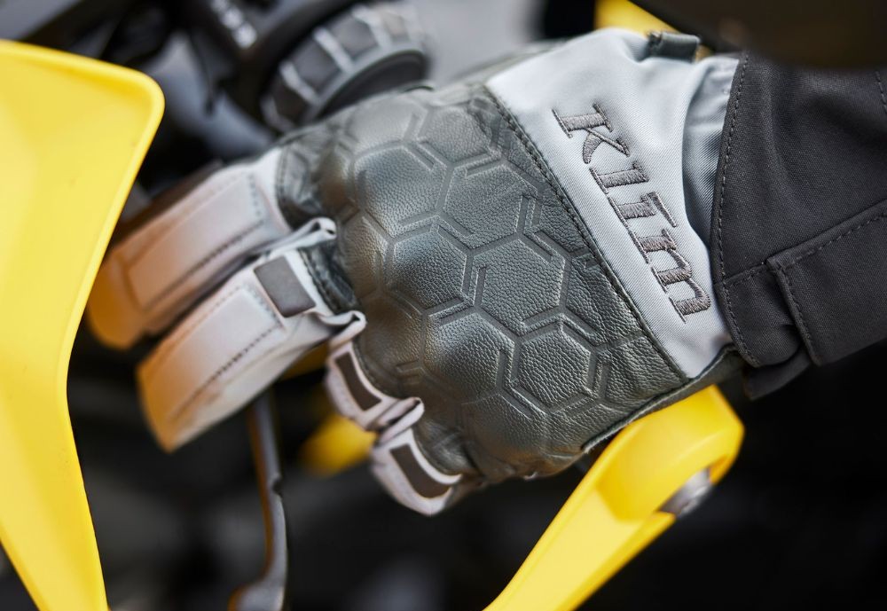 Klim Vanguard GTX Long Glove on a motorcycle handlebar in wet riding gear