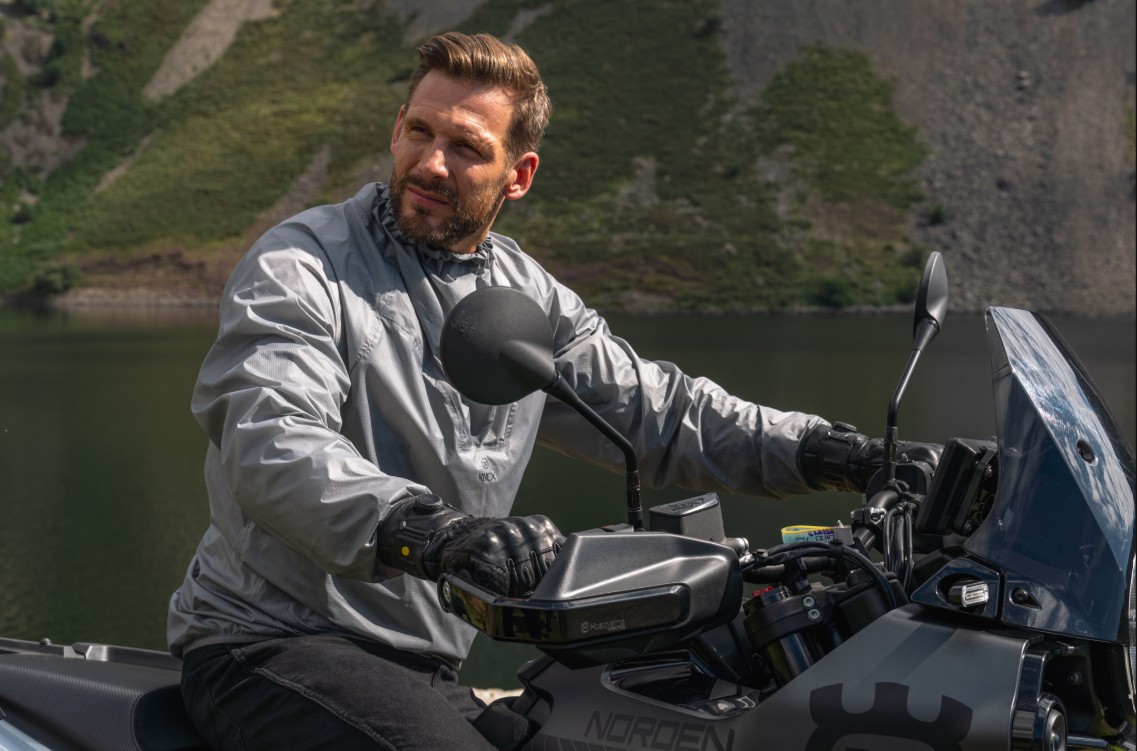 Rider wearing Knox Coniston Gloves on an adventure-style motorcycle, geared for 3-season commuting