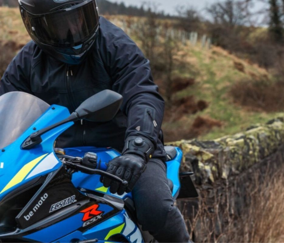 Rider wearing Knox Coniston Gloves while riding a sportbike in wet weather
