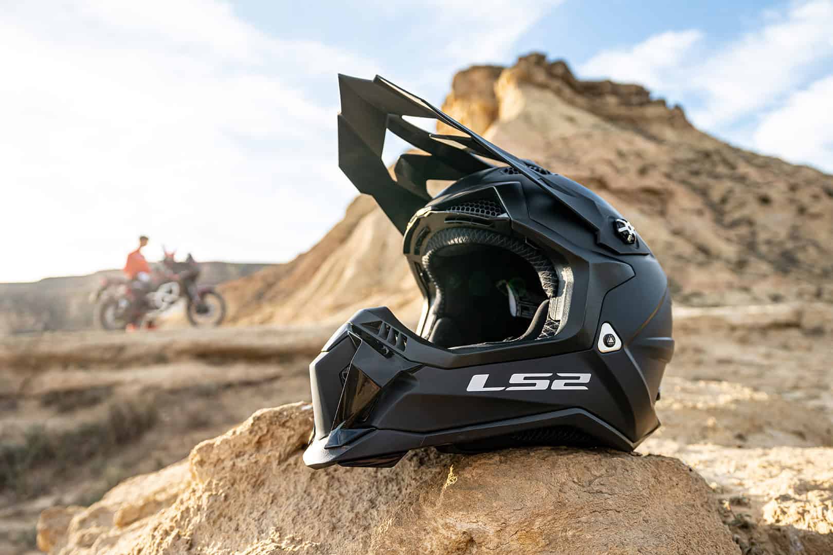 LS2 Subverter Evo dirt helmet resting on a rock in desert terrain