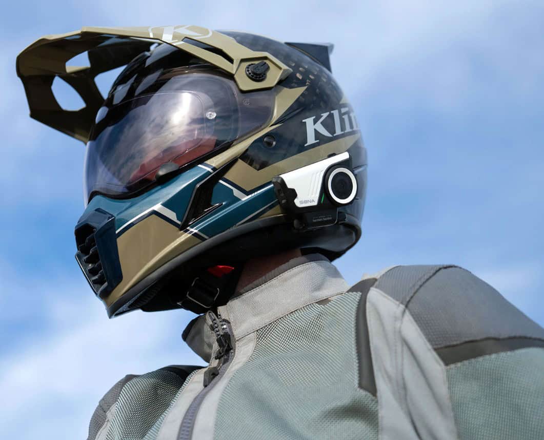 Adventure rider wearing helmet with Sena 60S communicator
