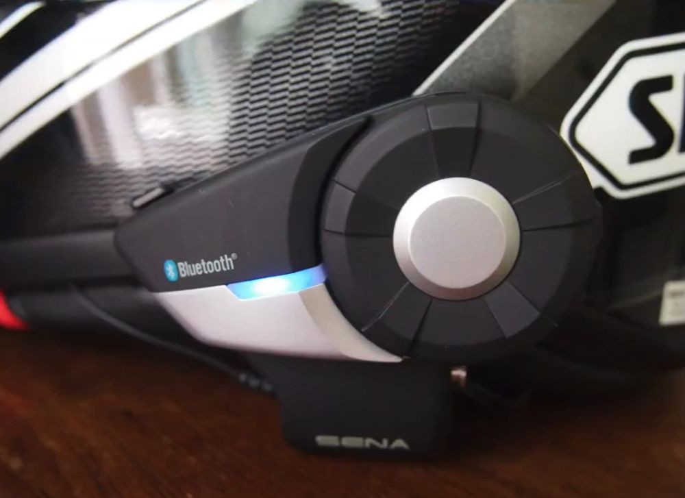 Sena 20S Evo Bluetooth unit mounted on motorcycle helmet