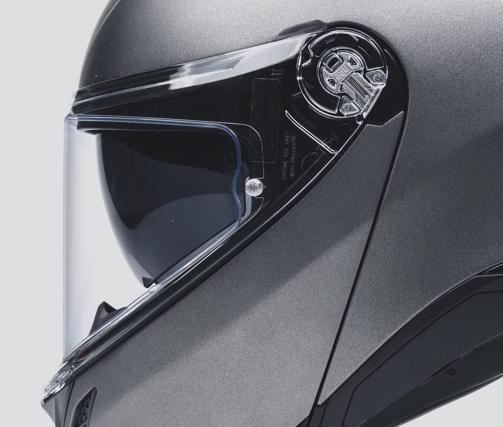 Close-up of AGV Tourmodular helmet visor mechanism showcasing Pinlock-ready anti-fog technology