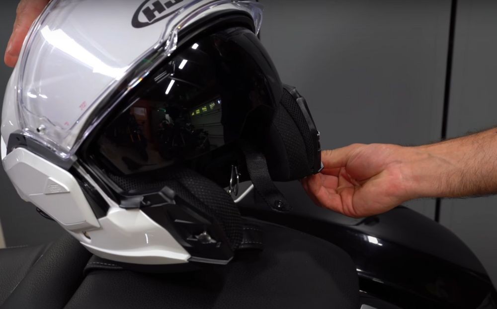 Close-up of internal sun shield partially deployed on the HJC i100 modular helmet