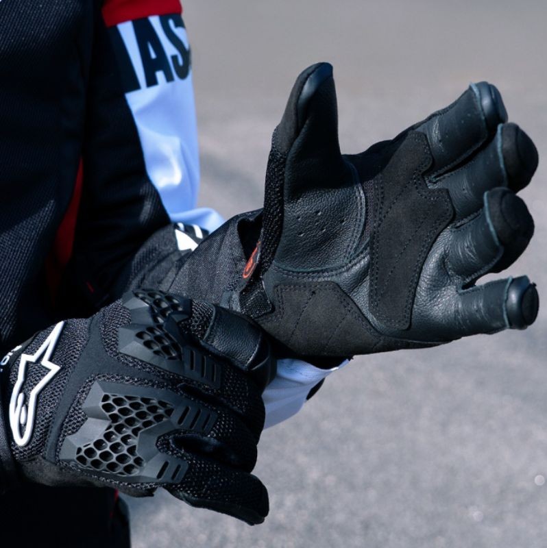Close-up of Alpinestars Manti Air gloves showing mesh airflow panels and leather palm