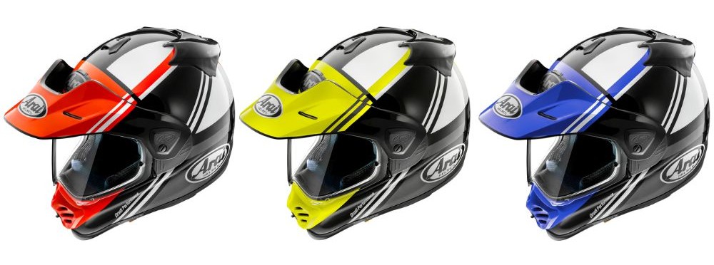 Three Arai XD-5 Cosmic Helmets in red, yellow, and blue graphics side-by-side