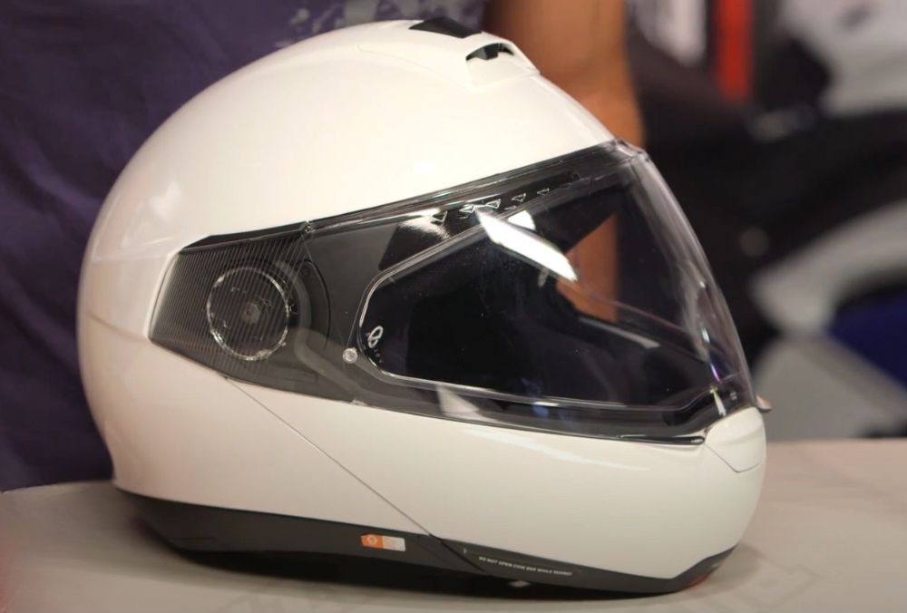 White Schuberth C4 modular touring helmet on display table