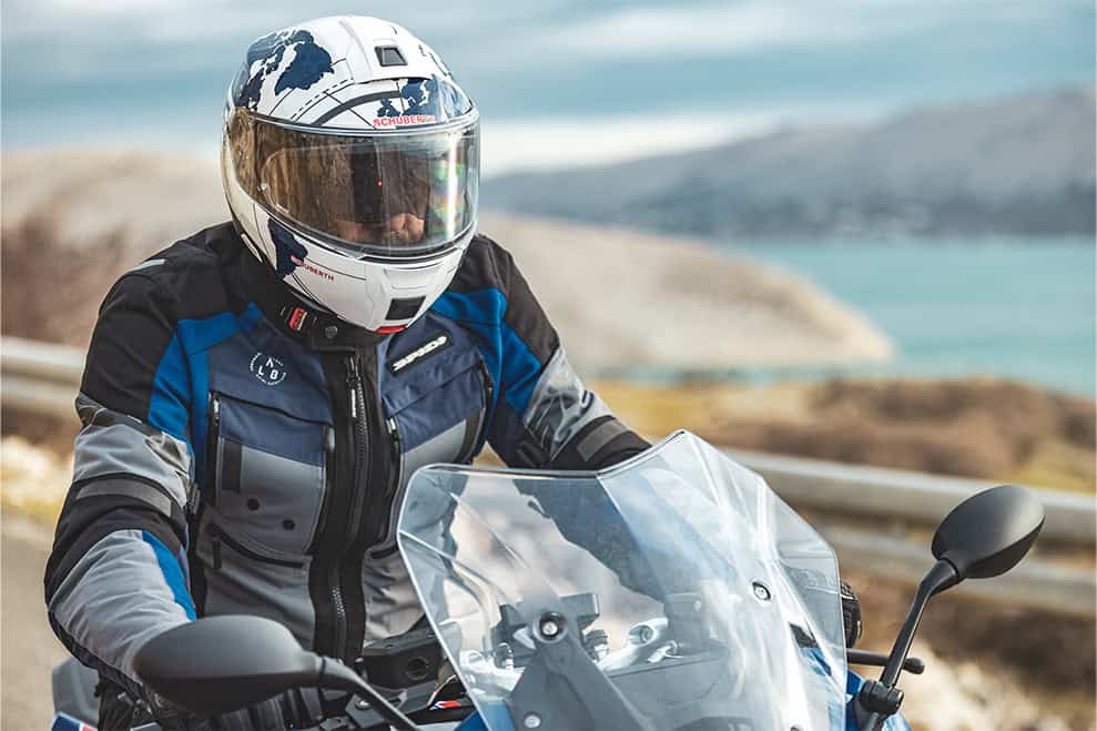 Rider wearing the Schuberth C5 modular helmet on a touring motorcycle