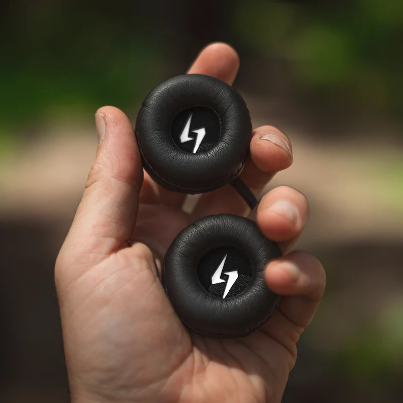 Close-up of Syphon SoundPro Ultra Thin helmet speakers held in hand