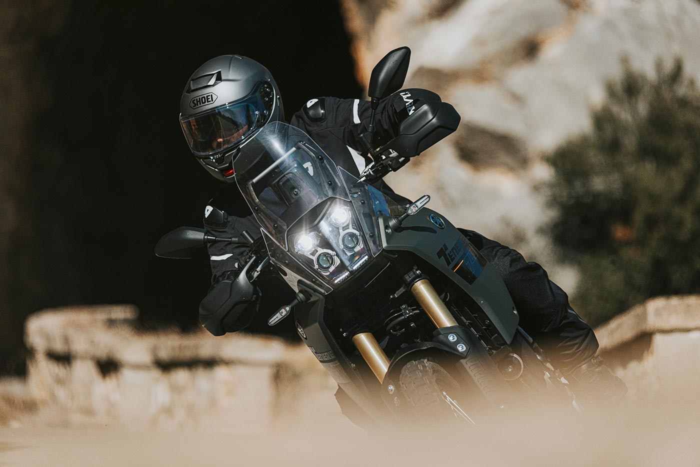 Motorcyclist cornering in touring gear with full-face helmet