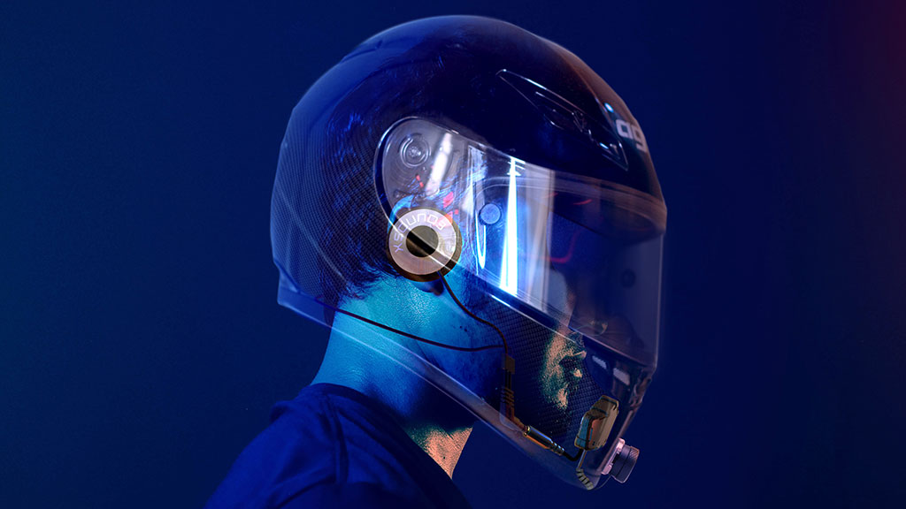 Visual overlay of IASUS XSound 3 helmet speakers inside a full-face motorcycle helmet, showing internal fit and cable routing.
