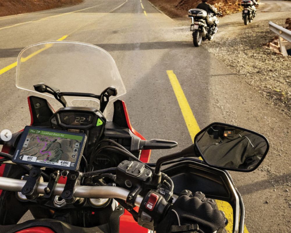 Garmin Zumo XT2 GPS mounted on a motorcycle dashboard during a ride