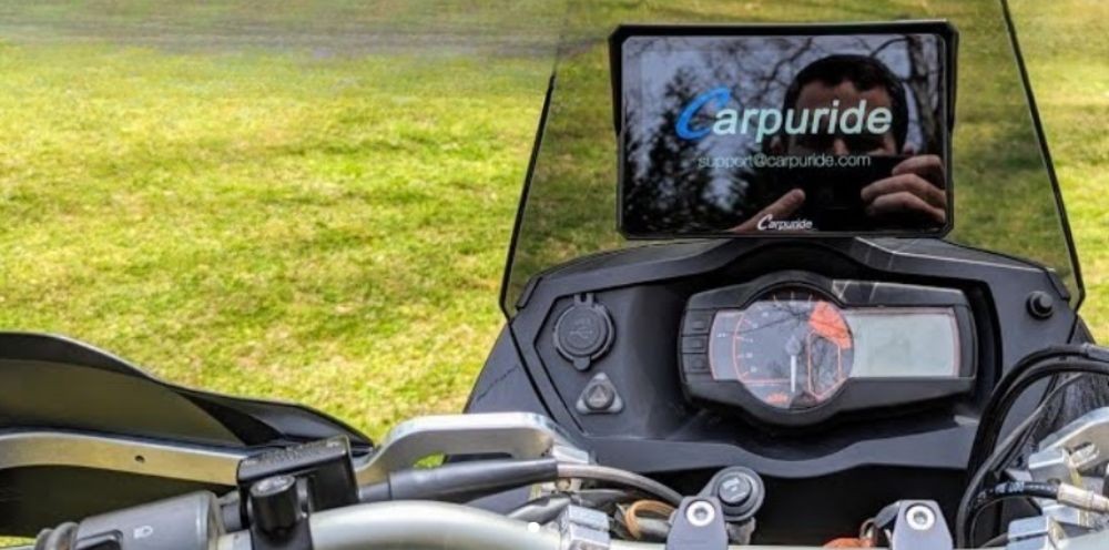 Carpuride CarPlay/Android Auto display mounted on a motorcycle cockpit