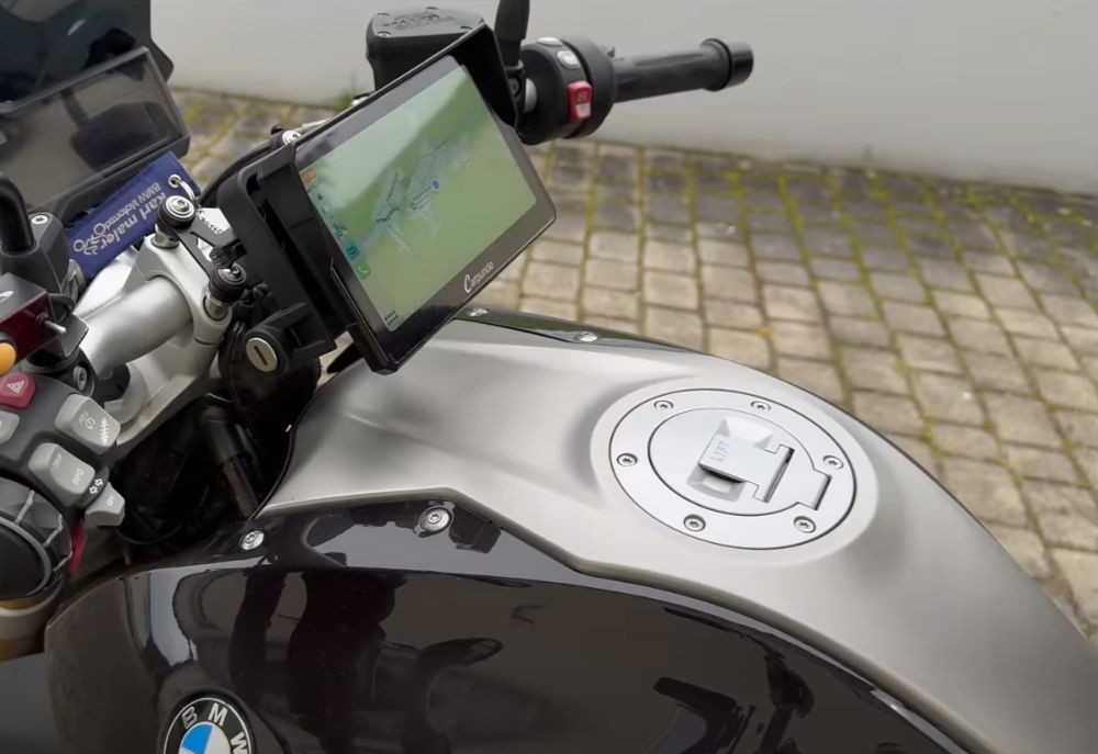 Carpuride 702B display mounted on BMW motorcycle cockpit with Nav Prep bracket