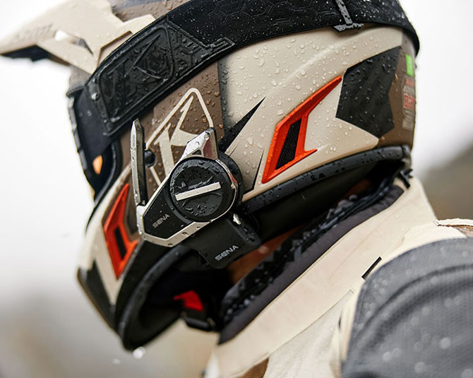 Sena headset mounted on adventure helmet with rain droplets