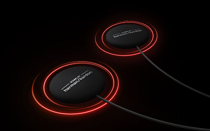 Close-up of Sena 50S Harman Kardon speakers glowing with red light effects, emphasizing premium audio quality.