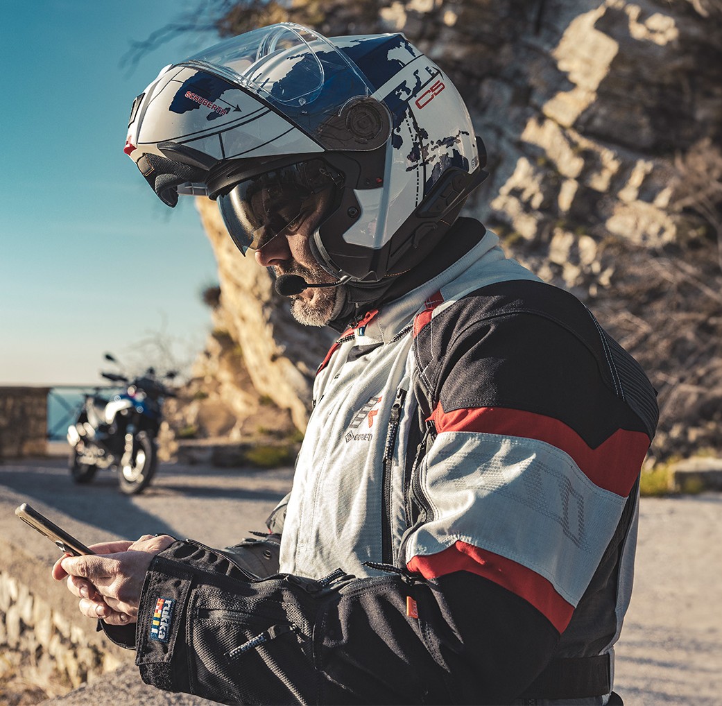 Rider wearing Schuberth C5 modular helmet with clear visor and integrated sun visor