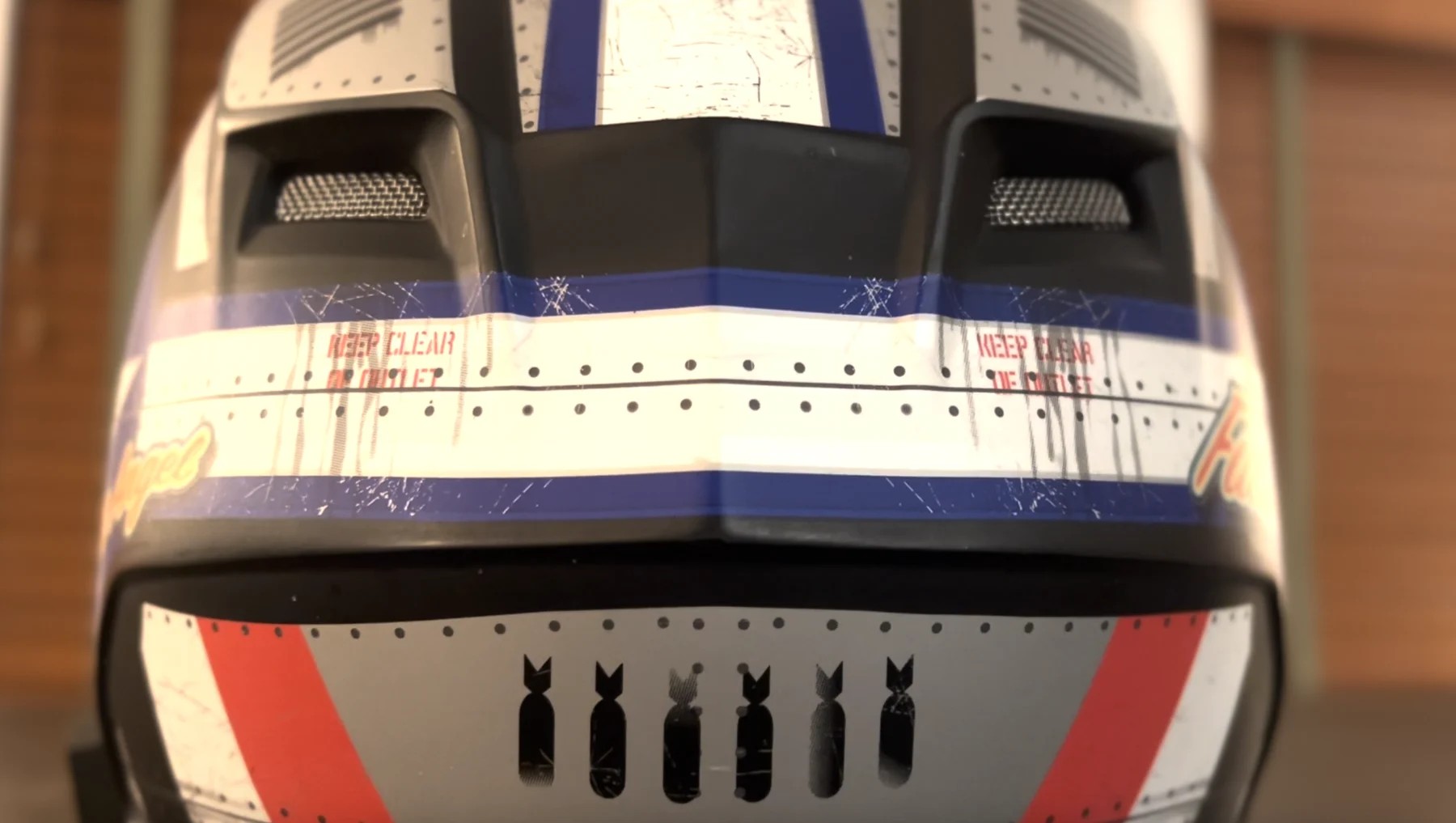 Close-up of Bell Qualifier DLX MIPS helmet vents showing intake and exhaust design.