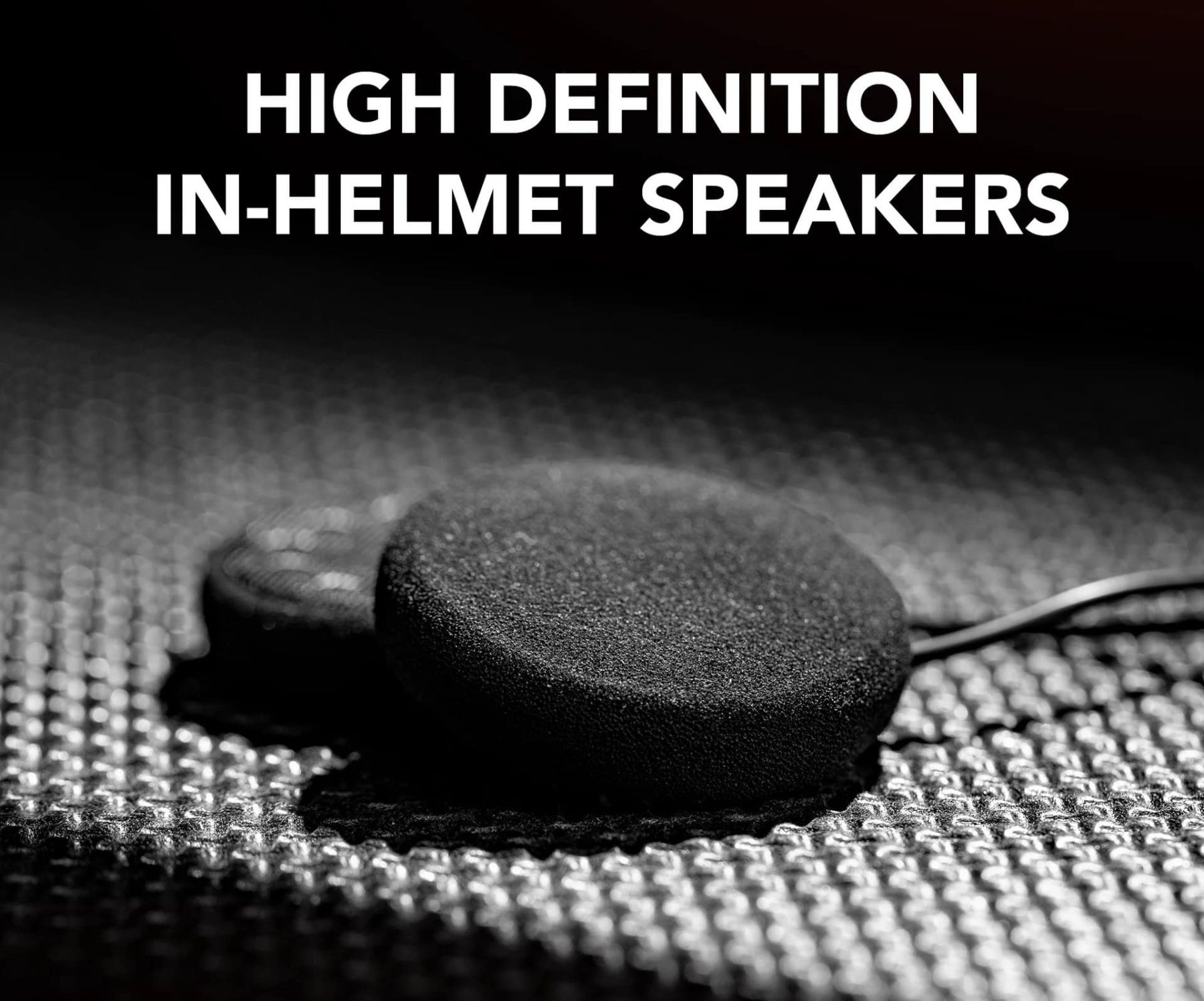 Close-up of Sena 5S high-definition helmet speakers on a textured surface.