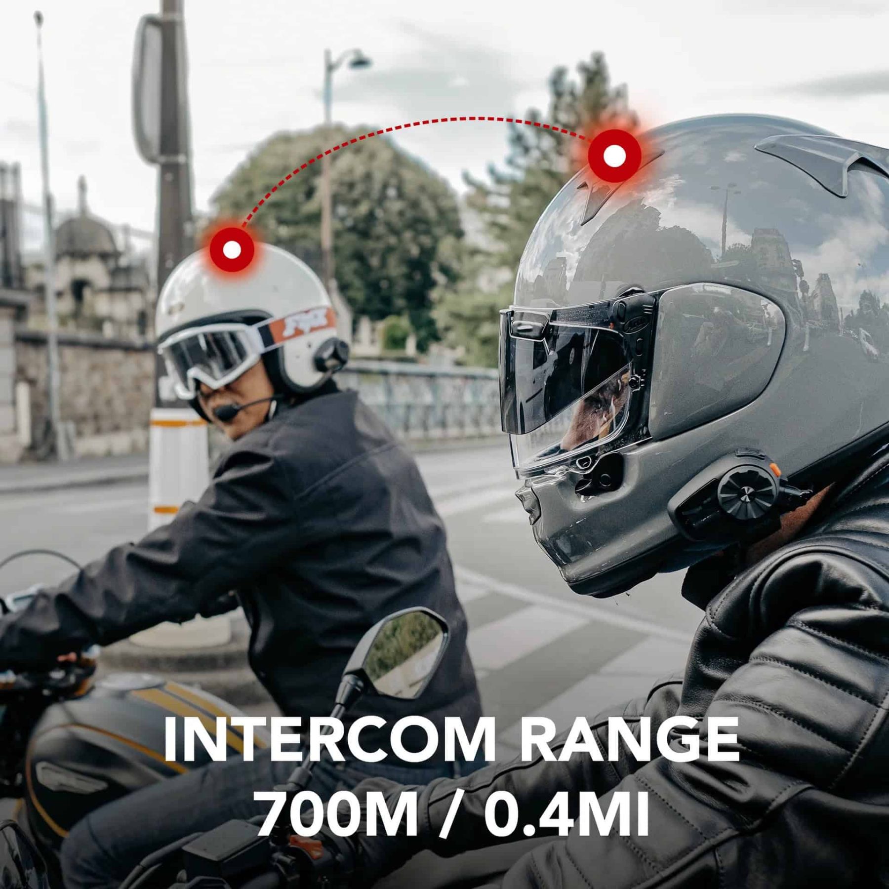 Two riders wearing helmets with Sena 5S units connected via Bluetooth intercom, showing range of 700m / 0.4mi.