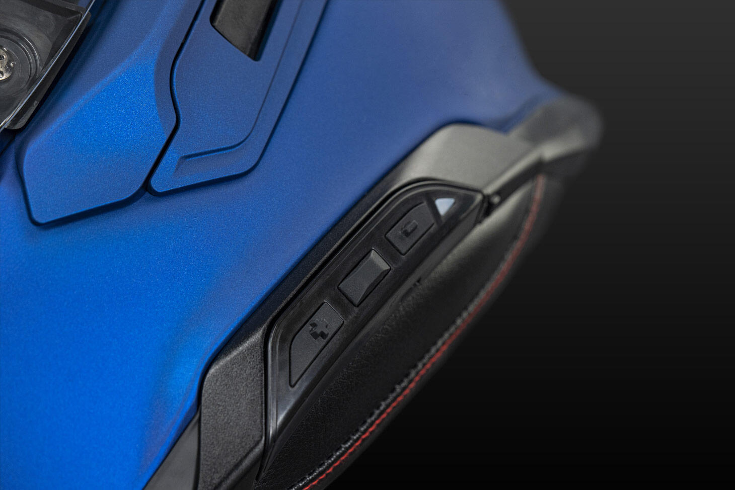 Shoei GT-Air 3 helmet showing integrated Comlink control panel for Sena SRL-3 system.