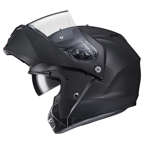 HJC C91 modular helmet in matte black, side profile view with visor raised, showing flip-up design and integrated sun visor.