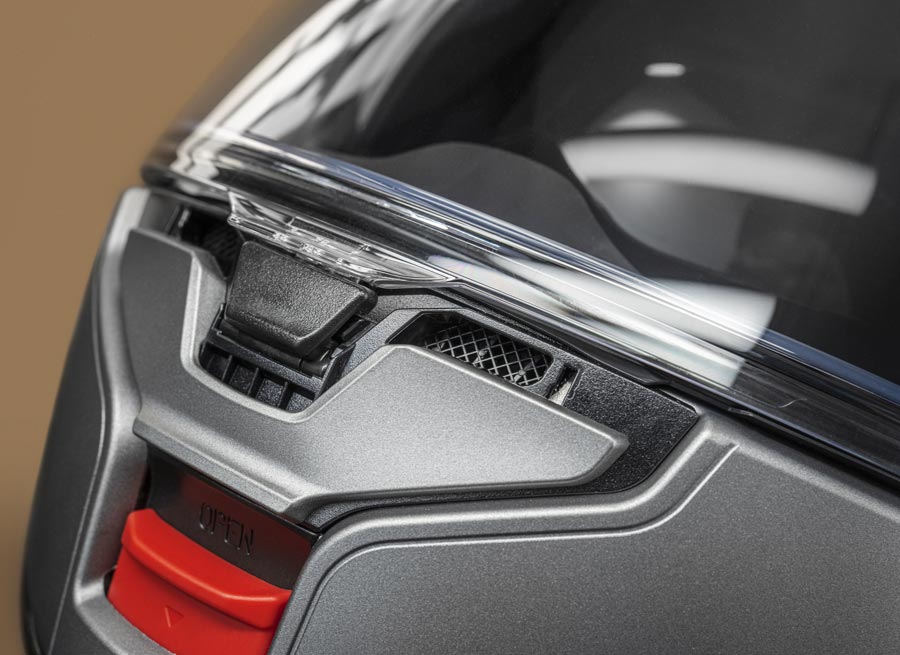 Close-up of Shoei Neotec 3 chin vent and visor showing redesigned defogger system