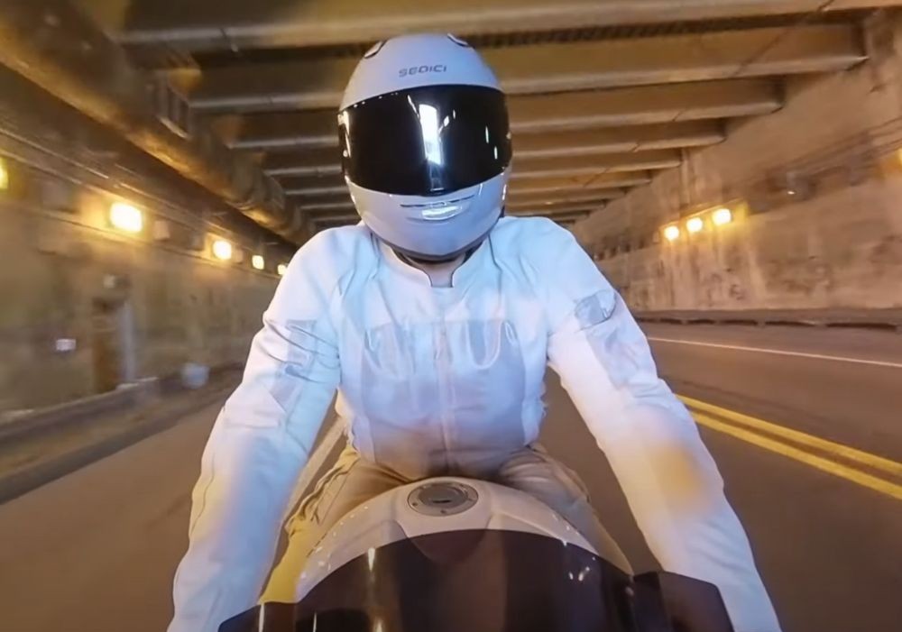 Rider wearing Sedici Strada 3 helmet in a tunnel, showcasing its fiberglass composite shell and sleek fit.