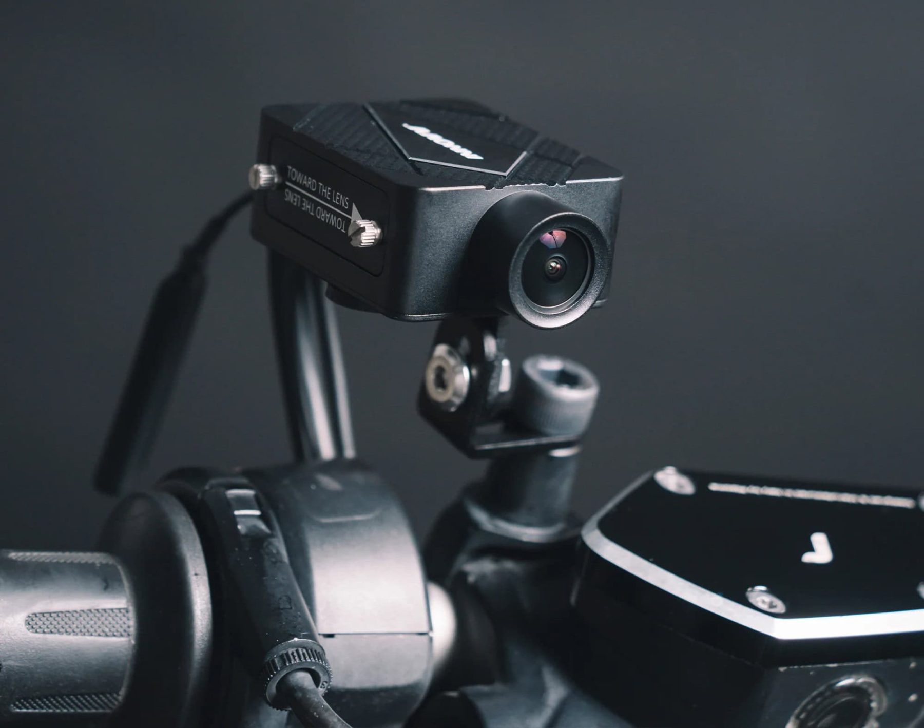 INNOVV K5 motorcycle dash cam mounted on handlebar close-up