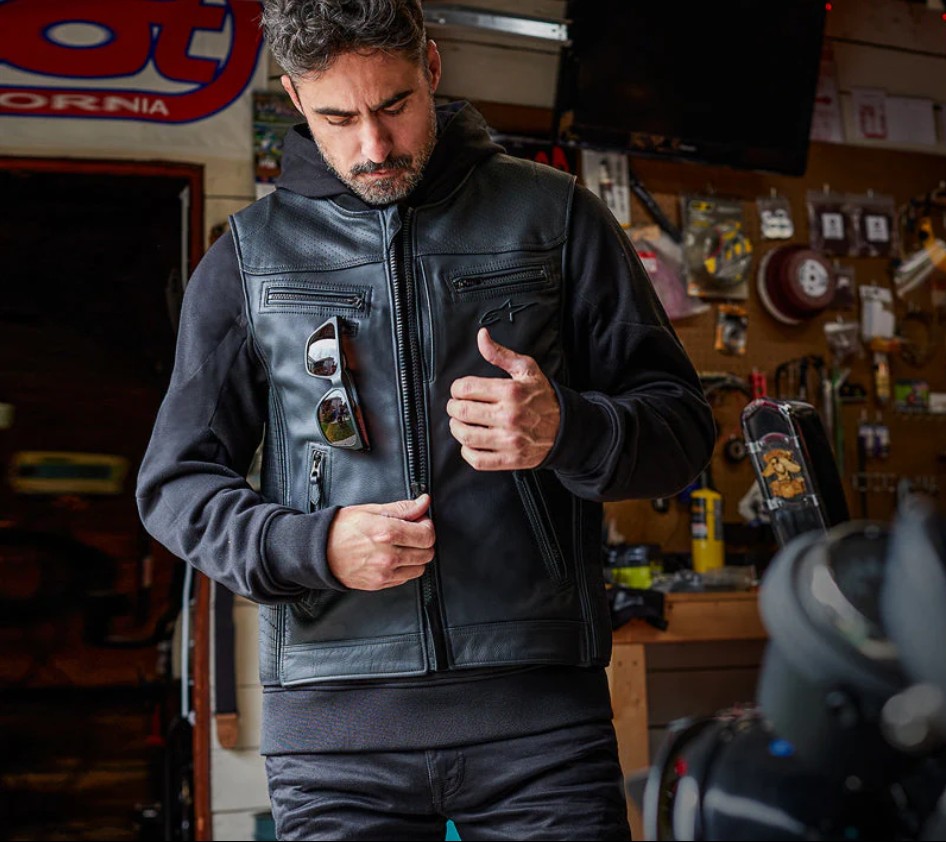 Man wearing the Alpinestars Tech-Air 3 V2 Leather Airbag Vest inside a workshop, showing its sleek and protective design.