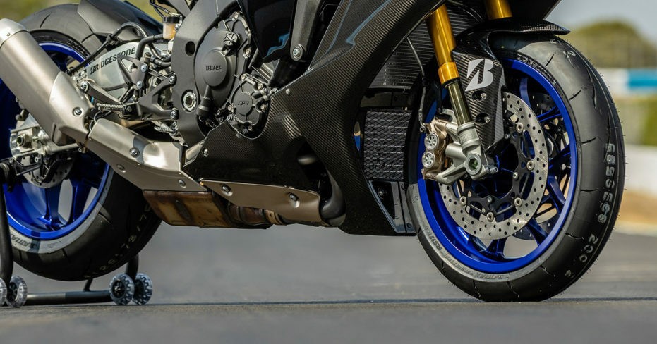 Close-up of sportbike fitted with Bridgestone Battlax RS11 tires, highlighting tread and racing performance design
