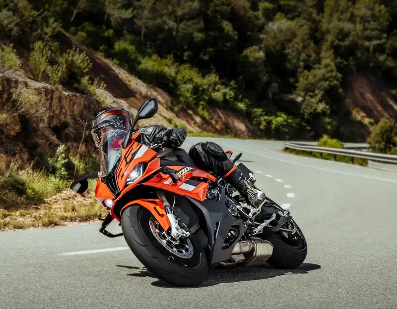 Rider leaning a sportbike on the street, showcasing Michelin Power GP 2 tire performance in a corner